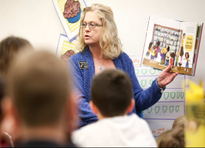 Rep. Gail Mooney reading Grace for President at her local elementary school.
